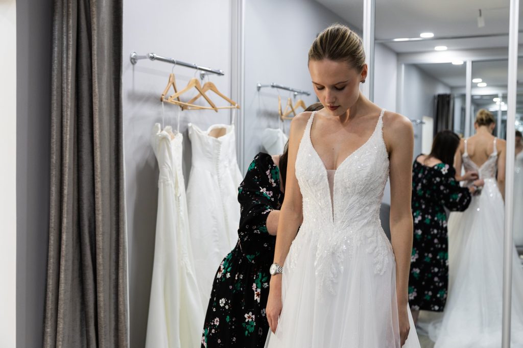 Bride in a V-neck lace wedding dress at VBB
