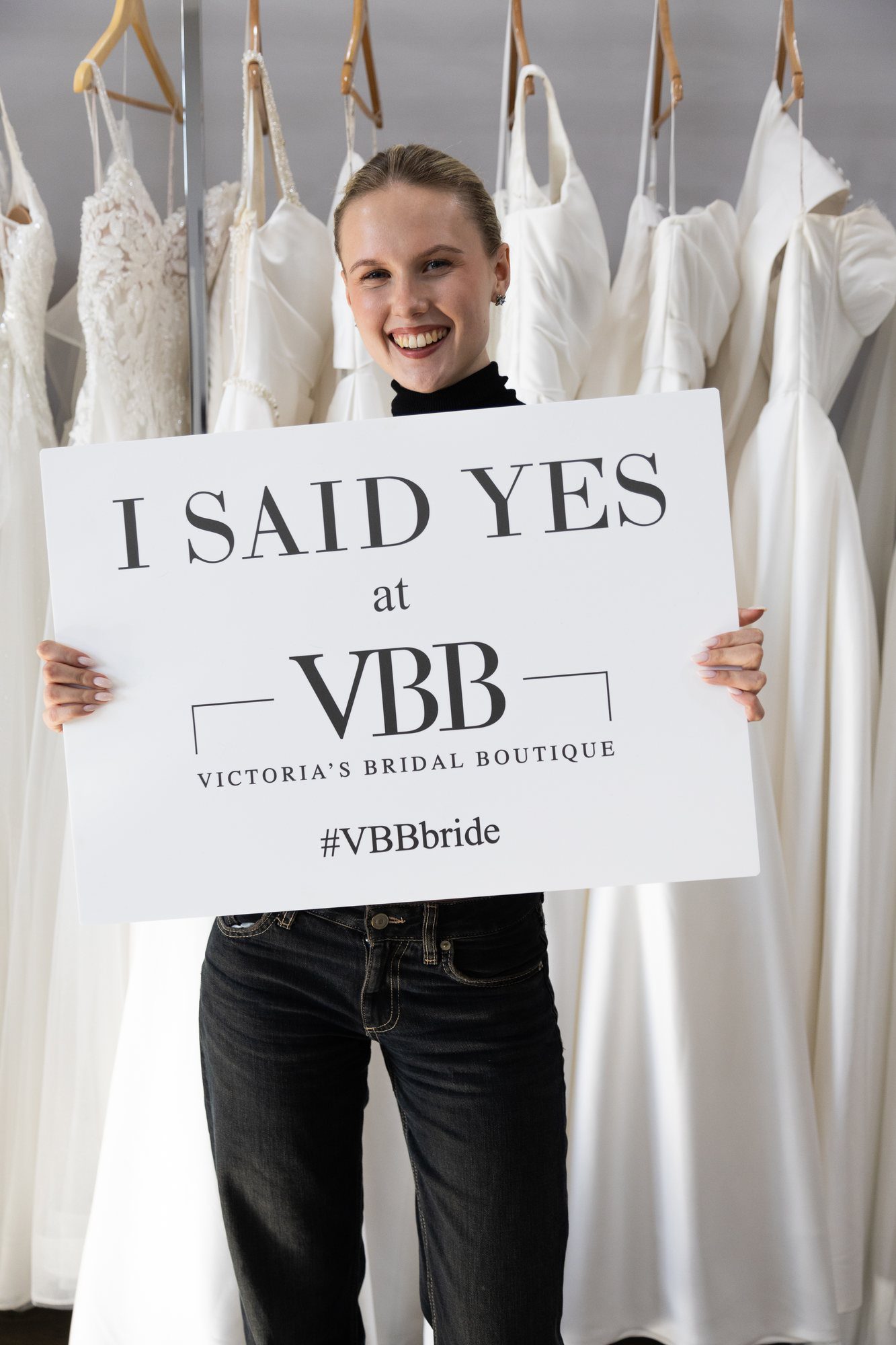 Bride holding an I Said Yes at VBB sign