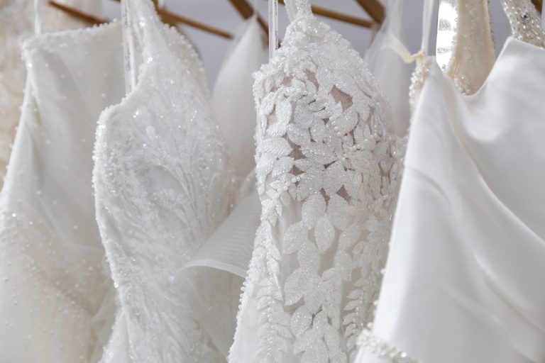 Close up of lace and beaded wedding dress bodices