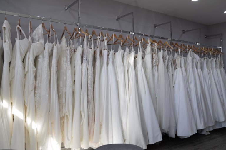 A rail of white wedding dresses at VBB